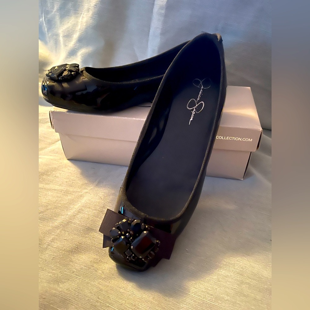 Black patent leather flats with jewel accents